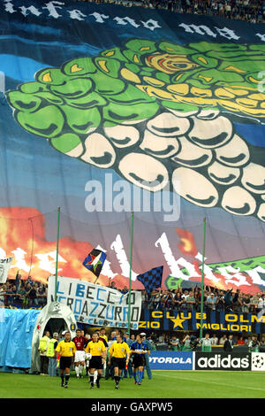 Soccer - UEFA Champions League - Semi Final - Second Leg - Inter Milan v AC Milan. Inter Milan and AC Milan players walk out in front of a giant banner at the Stadio Giuseppe Meazza. Stock Photo