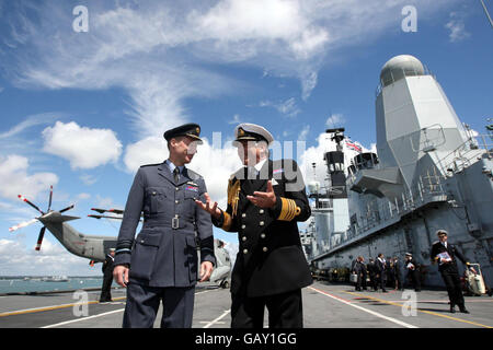 RAF's Deputy Commander in Chief of Operations, Air Marshal Iain McNicholl (left) and the Head of the Navy, the First Sea Lord, Admiral Sir Jonathon Bandon on the flight deck of the HMS Ark Royal as it sits in dock in Portsmouth. Stock Photo