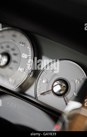 Close up shot of a car's dashboard with the fuel gauge. Stock Photo
