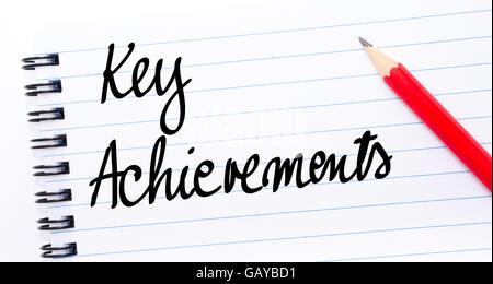 Key Achievements written on notebook page with red pencil on the right Stock Photo
