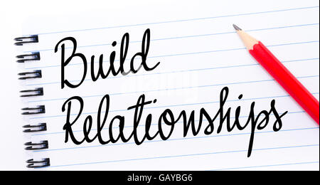 Build Relationships written on notebook page with red pencil on the right Stock Photo