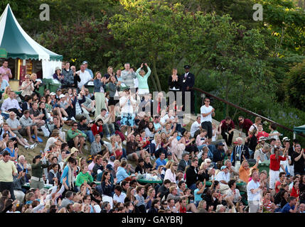 Spectators cheers as they watch the match between Great Britain's Andy Murray and France's Richard Gasquet during the Wimbledon Championships 2008 at the All England Tennis Club in Wimbledon. Stock Photo
