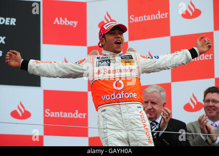 McLaren's Lewis Hamilton celebrates after winning the British Grand Prix at Silverstone, Northamptonshire. Stock Photo