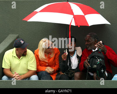 Richard Williams observes his daughters USA's Serena and Venus Williams in womens doubles action against during the Wimbledon Championships 2008 at the All England Tennis Club in Wimbledon. Stock Photo