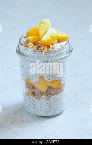Chia pudding with peach slices in a jar Stock Photo