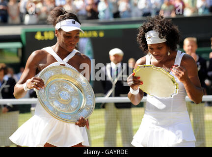 USA's Venus (left) and Serena Williams with their trophies following their Women's Final during the Wimbledon Championships 2008 at the All England Tennis Club in Wimbledon. Stock Photo