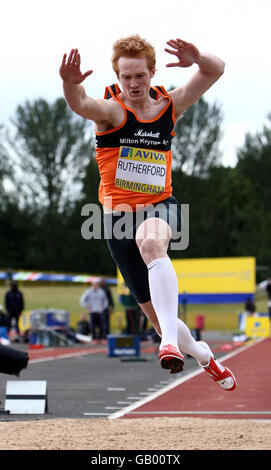 Greg Rutherford on his way to winning the long jump during the Norwich Union Olympic Trials and UK Championships at the Birmingham Alexander Stadium in Birmingham. Stock Photo