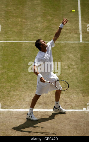 Russia's Marat Safin in action against Switzerland's Roger Federer during the Wimbledon Championships 2008 at the All England Tennis Club in Wimbledon. Stock Photo