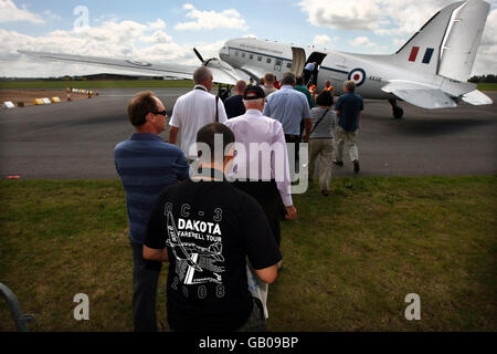 Air enthusiasts queue for the final flight of a Douglas DC3, better known as a Dakota, at Coventry Airport on the final day that it will be allowed to offer British passenger flights. Stock Photo