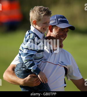 Republic of Ireland's Padraig Harrington and son Patrick (left) after Round Four of the Open Championship at the Royal Birkdale Golf Club, Southport. Stock Photo