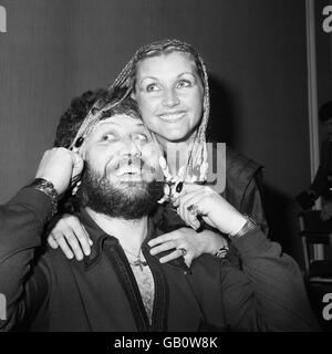 DJ Dave Lee Travis and his wife Marianne after receiving the 1979 Head of the Year Award as the man in public life who has brought credit to professional hairdressing by his high standard of personal grooming. Stock Photo