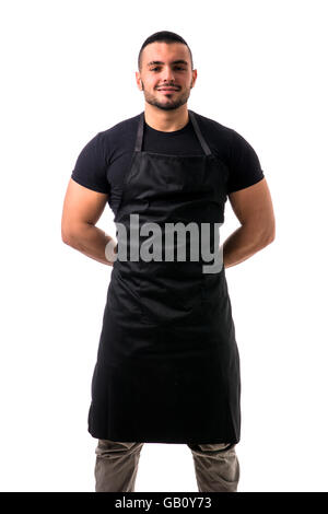 Portrait of handsome chef in black apron against of white background. Studio shot Stock Photo