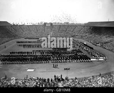 London Olympic Games 1948 - Opening Ceremony - Wembley. The teams lined up during the opening ceremony of the Olympic Games as 2500 pigeons are released at Wembley. Stock Photo