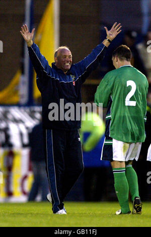 Northern Ireland manager Sammy McIlroy celebrates after the draw with Spain. Stock Photo