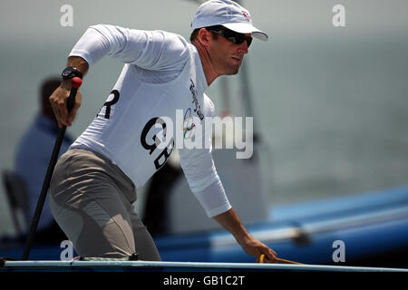 Great Britain's Finn sailor Ben Ainslie in action on the first day of racing in Qingdao during the Beijing Olympic Games. Stock Photo