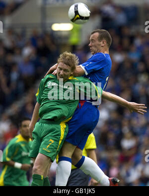 Rangers Charlie Adam battles with FBK Kaunas Linas Pilibaitis during the UEFA Champions League Qualifying Second Round First Leg match at Ibrox, Glasgow. Stock Photo