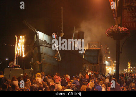 The grand finale of the Spraoi Festival, as a giant replica steam ship 'the Iron Tide' sails up the quays of Waterford, which use to be home to some of the biggest steam ships in the world. Stock Photo