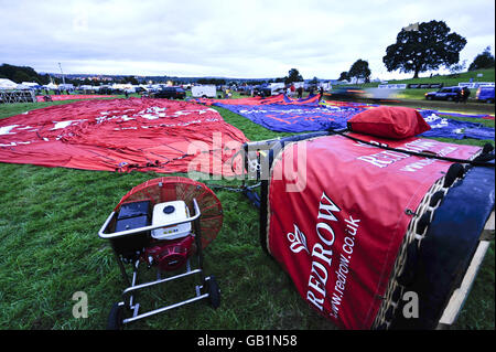 International Balloon Fiesta in Bristol. Balloons lie deflated before the planned take off at Bristol Balloon Fiesta 2008 at Ashton Court, Bristol. Stock Photo