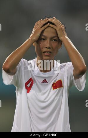 China's Zhang Ying reacts during their Olympic soccer match against Sweden at the Tianjin Olympic Center Stadium, China. Stock Photo