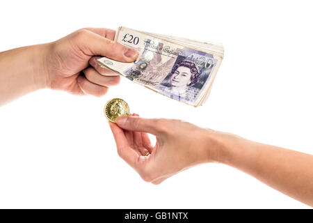 Close-up on hands exchanging gold coin on cash, isolated on the white background. Stock Photo