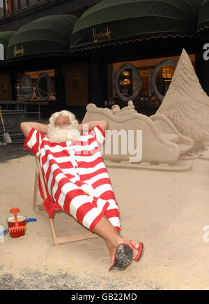 Father Christmas arrives to launch Christmas World at Harrods department store in west London. Stock Photo