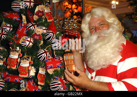 Father Christmas arrives to launch Christmas World at Harrods department store in west London. Stock Photo