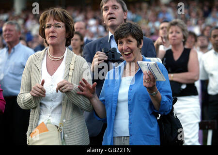Horse Racing - Epsom Races. Punters cheer on their horses Stock Photo