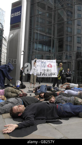 Protesters gather outside the Royal Bank of Scotland headquarters near Liverpool Street Station in London, claiming RBS is the British bank investing most in financing fossil fuel expansion across the world. Stock Photo