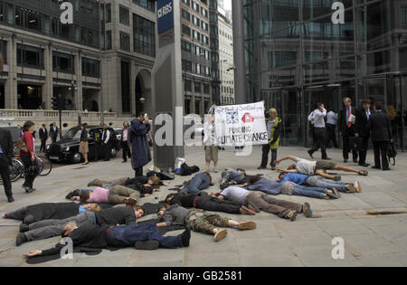 Protesters gather outside the Royal Bank of Scotland headquarters near Liverpool Street Station in London, claiming RBS is the British bank investing most in financing fossil fuel expansion across the world. Stock Photo