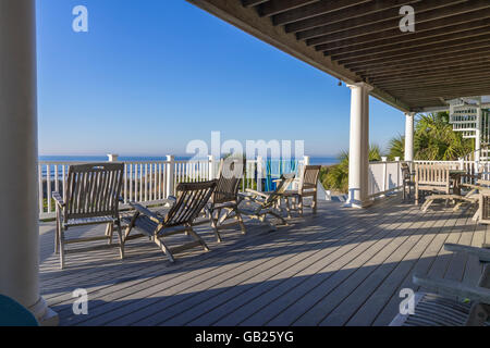 Deck Chairs Outside Deck Patio With Sunshine & Palm Tree, Hilton Head Beach, South Carolina USA Stock Photo