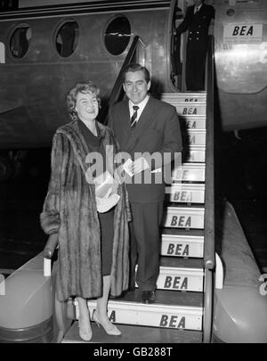 Comedian Tony Hancock and his wife were leaving from London Airport for Paris this evening for a short holiday. Stock Photo