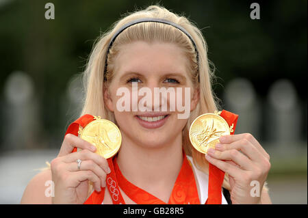 Great Britain's Rebecca Adlington shows off the two gold medals she won in the women's 800 and 400 metres freestyle finals at the National Aquatics Centre in Beijing. Stock Photo