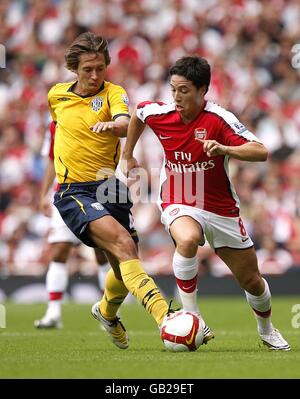 Soccer - Barclays Premier League - Arsenal v West Bromwich Albion - Emirates Stadium. Arsenal's Samir Nasri and West Bromwich Albion's Marek Cech (left) Albion battle for the ball Stock Photo