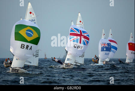 Great Britain's 470 girls Christina Bassadone and Saskia Clark (centre) during today's rounds of their Beijing Olympic competition at the 2008 Beijing Olympic Games Sailing Centre in Qingdao, China. Stock Photo