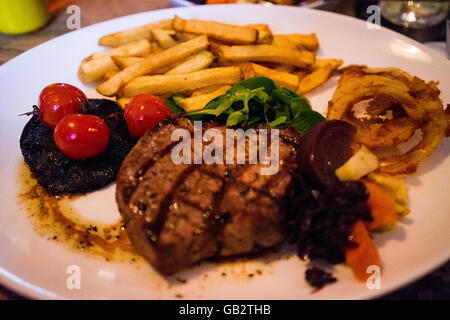 Steak and chips with cider meal pub eating traditional lunch Stock Photo