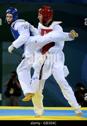 Great Britain's Aaron Cook (blue) in action against Italy's Mauro Sarmiento during their semi final match of the Men's 80kgs at the University of Science and Technology Beijing Gymnasium during the 2008 Beijing Olympic Games in China. Stock Photo