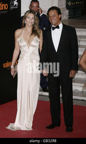 Elizabeth Hurley and husband Arun Nayar attend the premiere of the movie 'Valentino: The Last Emperor' held at Teatro La Fenice during the 65th Venice Film Festival. Stock Photo