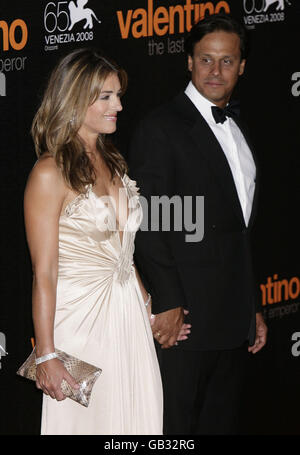 Elizabeth Hurley and husband Arun Nayar attend the premiere of the movie 'Valentino: The Last Emperor' held at Teatro La Fenice during the 65th Venice Film Festival. Stock Photo