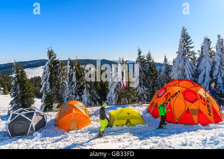 GORCE MOUNTAINS, POLAND - FEB 14, 2015: colorful tents of winter camp located near Turbacz shelter. Every February tourists lear Stock Photo