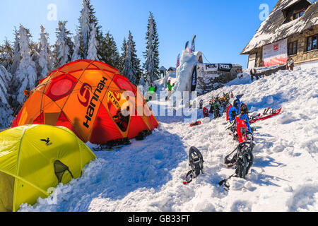 GORCE MOUNTAINS, POLAND - FEB 14, 2015: colorful tents of winter camp located near Turbacz shelter. Every February tourists lear Stock Photo