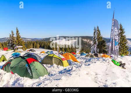 GORCE MOUNTAINS, POLAND - FEB 14, 2015: colorful tents of winter camp located near Turbacz shelter. Every February tourists lear Stock Photo