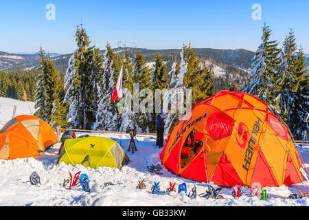 GORCE MOUNTAINS, POLAND - FEB 14, 2015: colorful tents of winter camp located near Turbacz shelter. Every February tourists lear Stock Photo