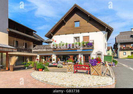 Traditional alpine houses with flowers on balcony, Cortina d'Ampezzo ...