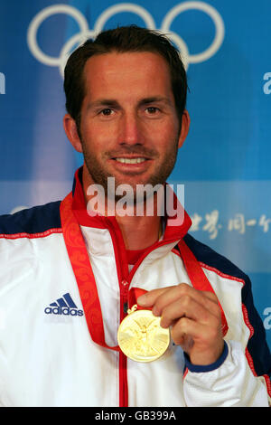 Great Britain's Ben Ainslie celebrates winning a gold medal in the Finn class at the 2008 Beijing Olympic Games' Sailing Centre in Qingdao, China. Stock Photo