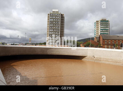 Flood water blocks the main Westlink road to the M1 in Belfast as clear up work begins in Belfast after Saturday's flooding following torrential rain. Stock Photo