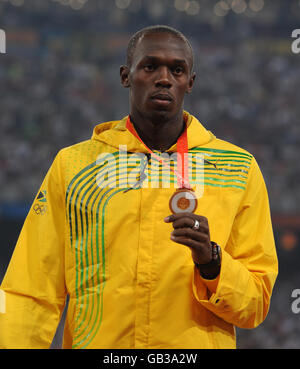 Jamaica's Usain Bolt with his Gold Medal for the Men's 100m Final at Beijing's National Stadium Stock Photo