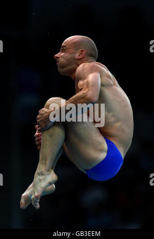 Great Britain's Peter Waterfield during a dive in the Men's 10 Metre Platform semi final at the National Aquatics Center during the 2008 Beijing Olympic Games, China. Stock Photo