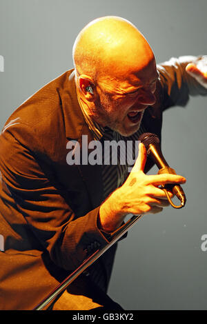 Michael Stipe of REM performs live on stage at Twickenham Rugby Stadium in West London. Stock Photo