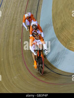 The Dutch team in action during the qualifying round of the Track Cycling Men's Team Sprint event at the Laosham Velodrome in Beijing, China, during the 2008 Beijing Olympic Games. Hoy and his team won gold in this event. Stock Photo