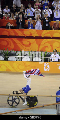 Former Prime Minister Tony Blair applauds Great Britain's Victoria Pendleton after her Gold Medal victory in the Women's Sprint in the Laoshan Velodrome at the 2008 Beijing Olympic Games in China. Stock Photo